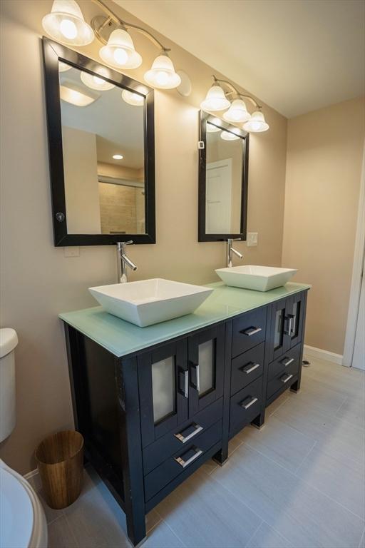 575 E St, Mansfield, MA 02048 - bathroom featuring double vanity and tile patterned floors