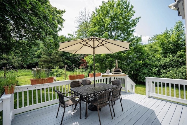 575 E St, Mansfield, MA 02048 - wooden terrace with outdoor dining space, a yard, and view of scattered trees