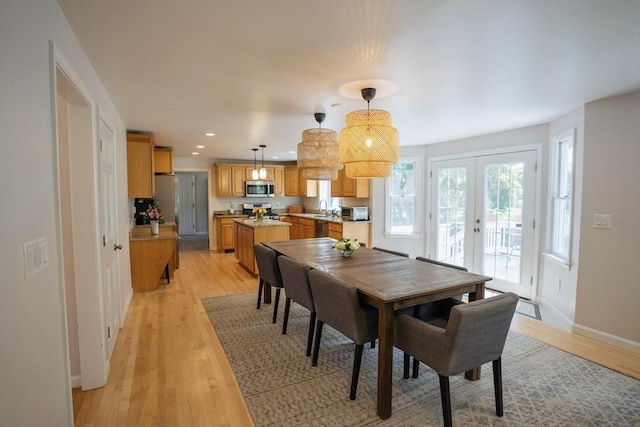 575 E St, Mansfield, MA 02048 - dining room with french doors, light wood-type flooring, and recessed lighting