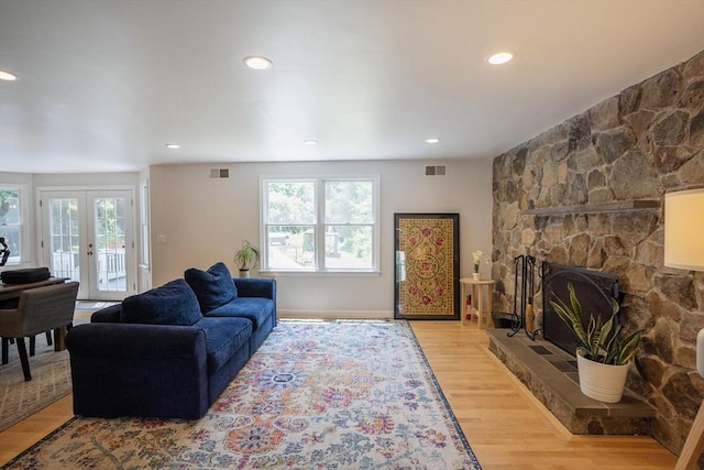 575 E St, Mansfield, MA 02048 - living area featuring wood finished floors, french doors, recessed lighting, and a fireplace