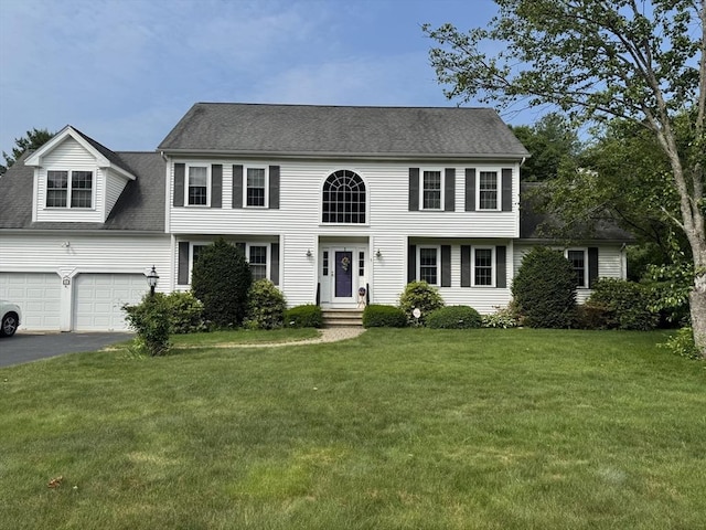 5 Gannett Way, Hopedale, MA 01747 - view of front of house with asphalt driveway, a front yard, an attached garage, and a shingled roof