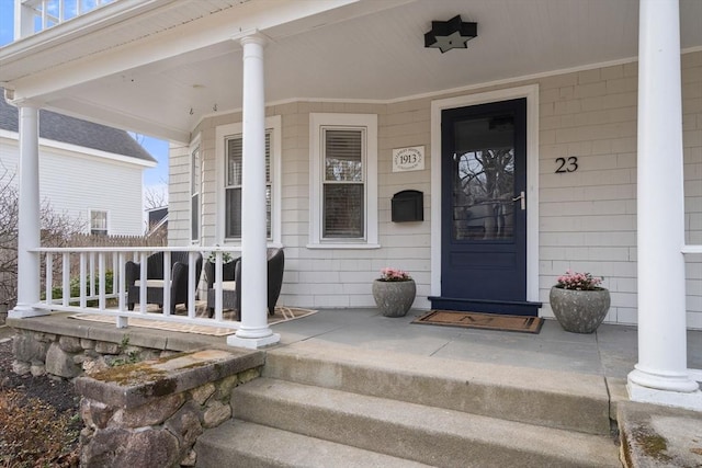 doorway to property featuring covered porch