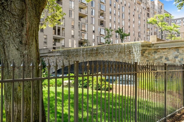 view of gate with fence