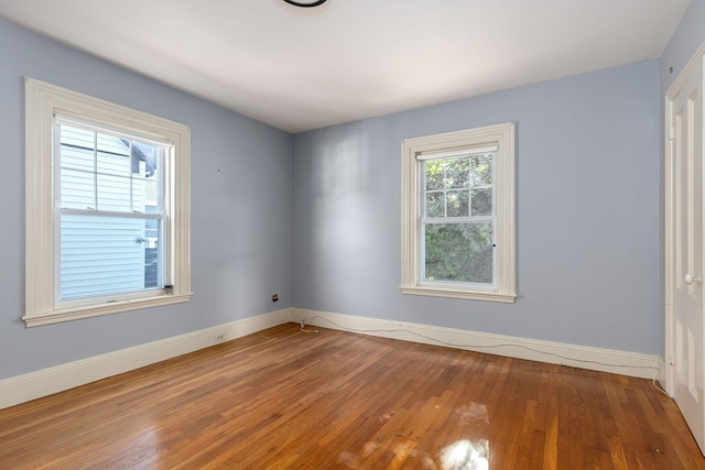 spare room featuring hardwood / wood-style flooring