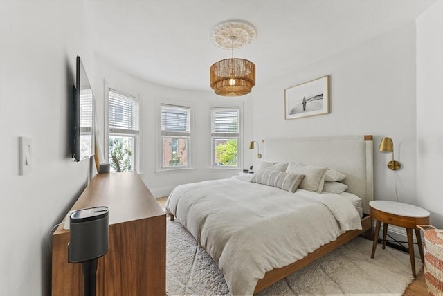 bedroom with light wood finished floors