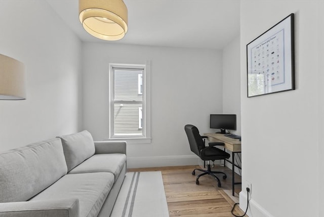 office space featuring wood finished floors and baseboards