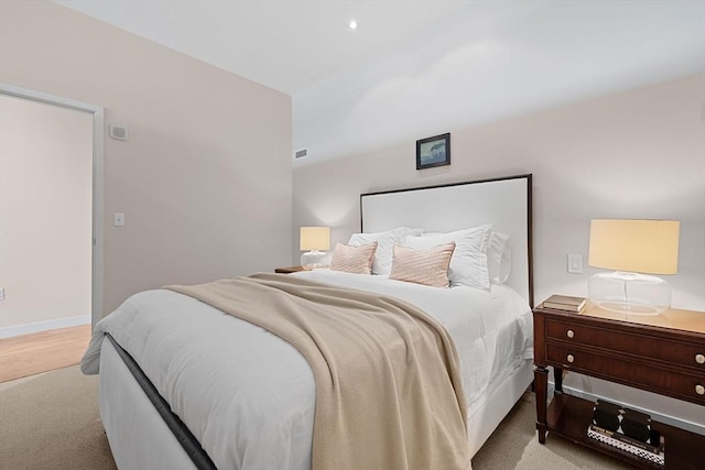 carpeted bedroom with baseboards