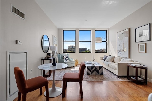 living room featuring wood finished floors and baseboards