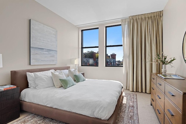 bedroom featuring light carpet