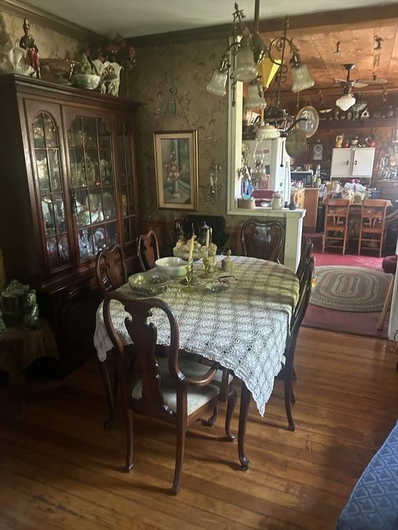 221 Summer St, Dighton, MA 02764 - dining area with wood-type flooring, ornamental molding, and wallpapered walls