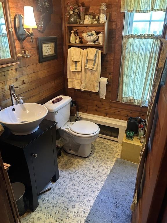 221 Summer St, Dighton, MA 02764 - bathroom with wood walls and vanity
