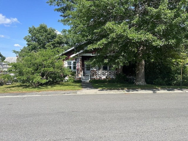221 Summer St, Dighton, MA 02764 - view of property hidden behind natural elements featuring covered porch