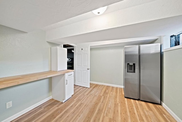 24 Summer St Unit A, Kingston, MA 02364 - kitchen with stainless steel fridge with ice dispenser, butcher block countertops, light wood-style flooring, and white cabinets