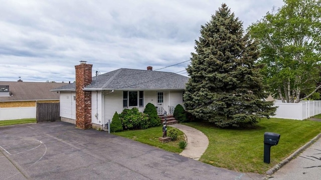 20 Roy St, Fairhaven, MA 02719 - view of front of property featuring a chimney and roof with shingles