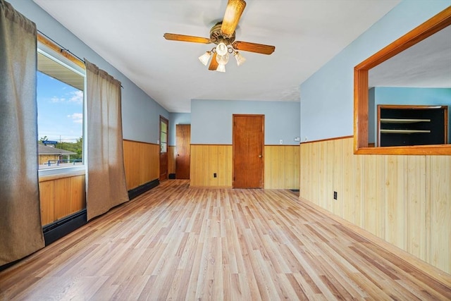 20 Roy St, Fairhaven, MA 02719 - spare room featuring wainscoting, wood walls, wood finished floors, and ceiling fan