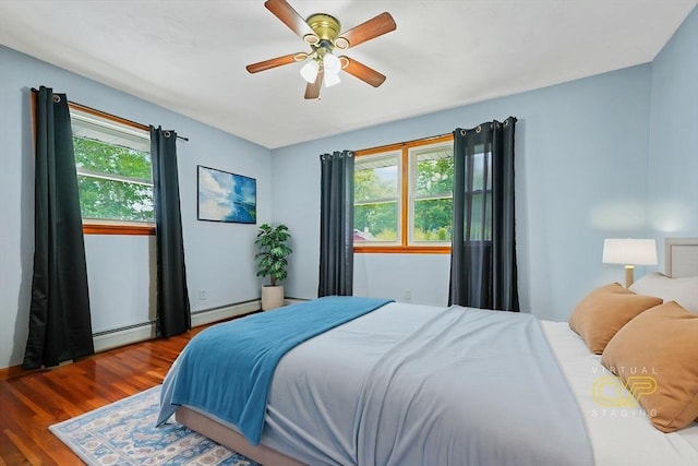 20 Roy St, Fairhaven, MA 02719 - bedroom with multiple windows, wood finished floors, and baseboard heating