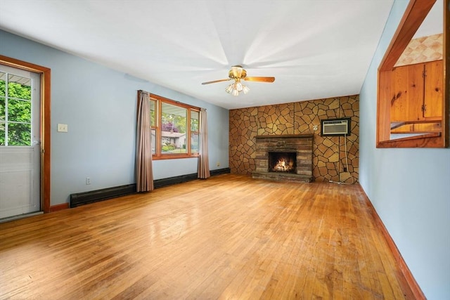 20 Roy St, Fairhaven, MA 02719 - unfurnished living room with plenty of natural light, light wood-type flooring, and a stone fireplace