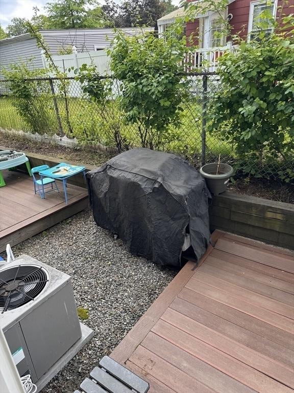 97 Hildreth St Unit 3, Lowell, MA 01850 - wooden terrace with central AC unit