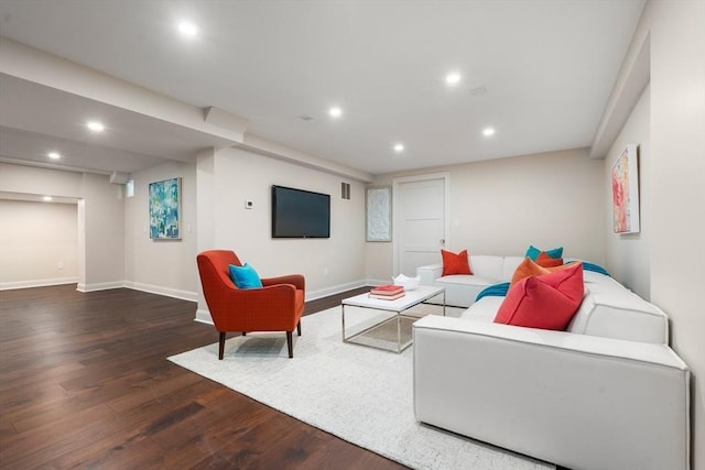 living room with dark wood-style floors, baseboards, visible vents, and recessed lighting