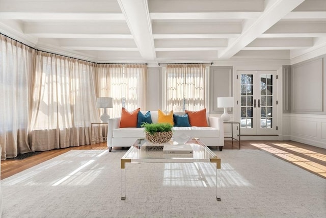 unfurnished sunroom with french doors, coffered ceiling, and beamed ceiling