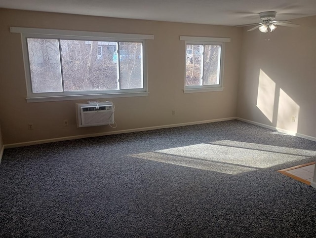 carpeted spare room with baseboards, a ceiling fan, and a wall mounted AC