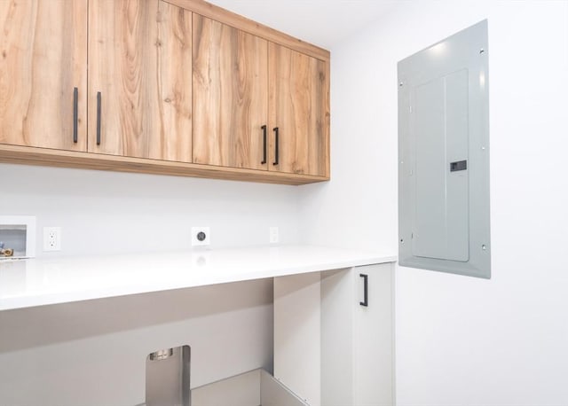 laundry room with washer hookup, hookup for an electric dryer, electric panel, and cabinet space