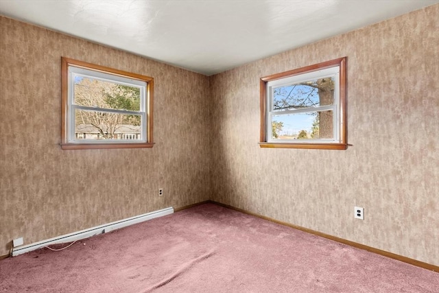 unfurnished room featuring baseboards, carpet floors, and a baseboard radiator