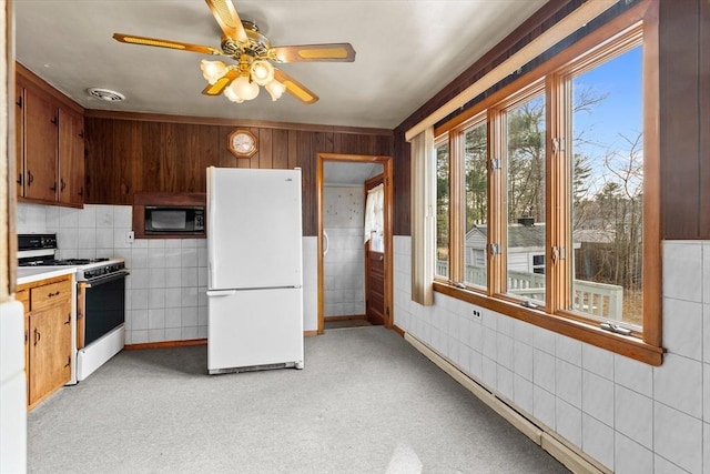 kitchen with white appliances, visible vents, ceiling fan, light countertops, and tile walls