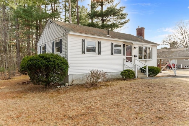 view of front of home featuring a chimney