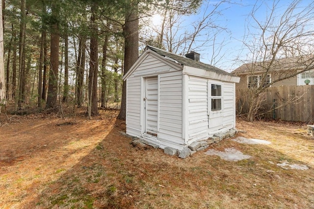 view of shed with fence