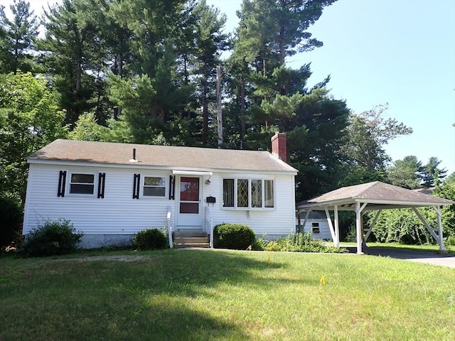 view of front facade featuring a chimney, a front yard, and entry steps