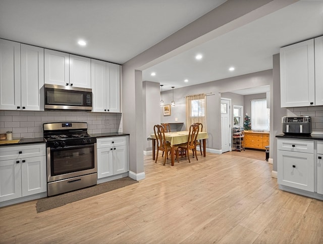 kitchen featuring white cabinetry and appliances with stainless steel finishes