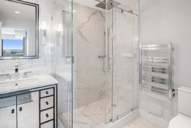 bathroom featuring vanity, a shower with shower door, toilet, and radiator heating unit