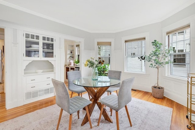 100 Melrose St Unit 100, Arlington, MA 02474 - dining space with light wood-style floors, ornamental molding, and built in features