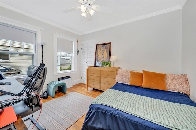 100 Melrose St Unit 100, Arlington, MA 02474 - bedroom with wood finished floors, crown molding, a desk, a ceiling fan, and baseboards