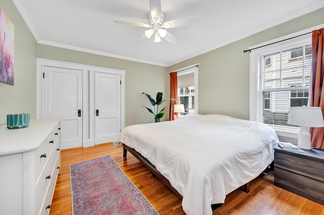 100 Melrose St Unit 100, Arlington, MA 02474 - bedroom with multiple windows, crown molding, light wood-style flooring, and ceiling fan