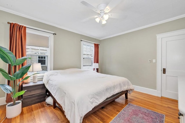 100 Melrose St Unit 100, Arlington, MA 02474 - bedroom featuring multiple windows, ornamental molding, light wood-type flooring, baseboards, and a ceiling fan