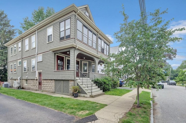100 Melrose St Unit 100, Arlington, MA 02474 - view of front of house with central air condition unit and covered porch
