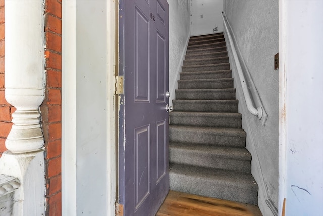 stairs with wood-type flooring