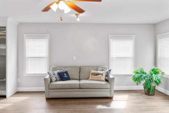 living room with plenty of natural light and light wood-type flooring