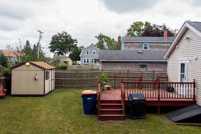 exterior space with a storage shed and a wooden deck