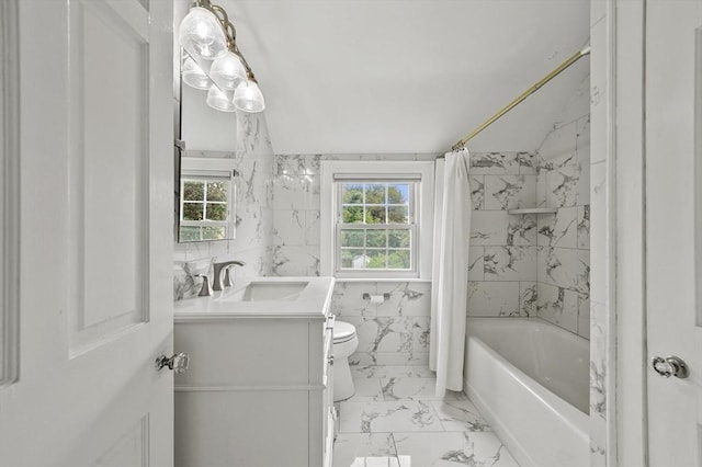223 Warren St, Waltham, MA 02453 - bathroom featuring marble look tile flooring, vanity, toilet, and shower / tub combo with curtain