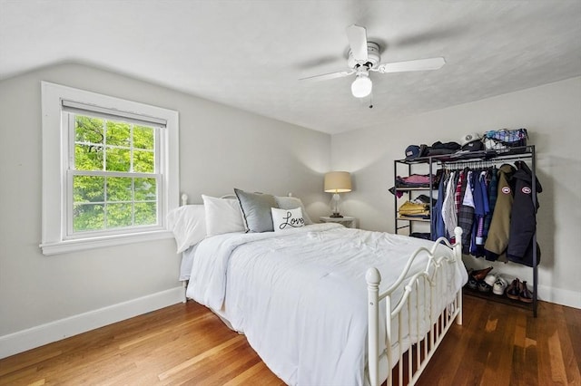 223 Warren St, Waltham, MA 02453 - bedroom featuring wood finished floors, baseboards, vaulted ceiling, and a ceiling fan