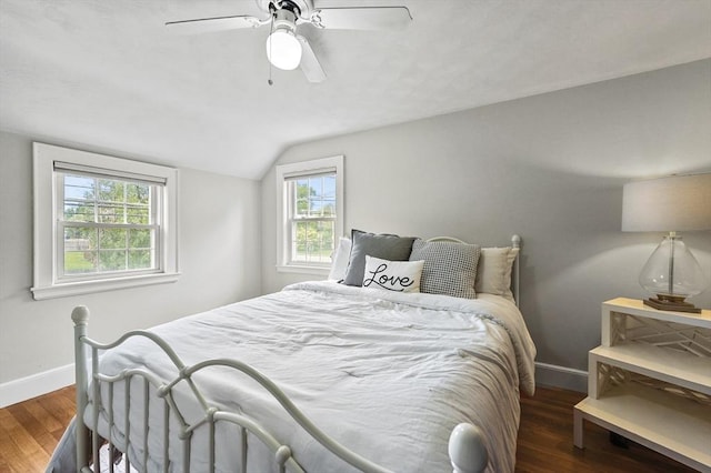 223 Warren St, Waltham, MA 02453 - bedroom featuring baseboards, lofted ceiling, multiple windows, wood finished floors, and ceiling fan