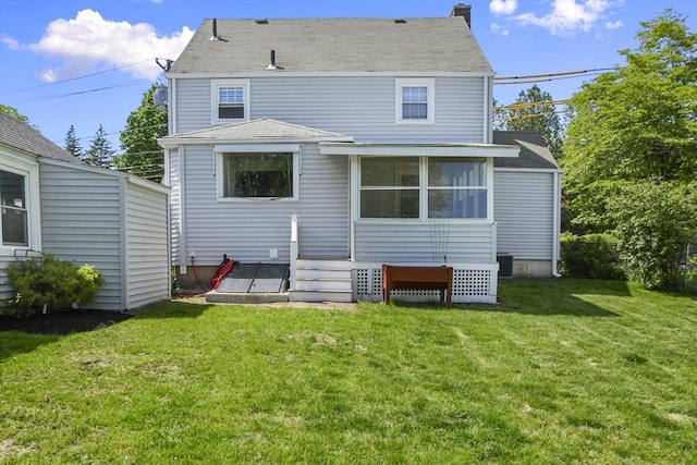 223 Warren St, Waltham, MA 02453 - rear view of property featuring a yard and central AC