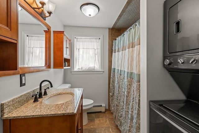 bathroom featuring stacked washer and dryer, toilet, baseboard heating, a shower with shower curtain, and vanity
