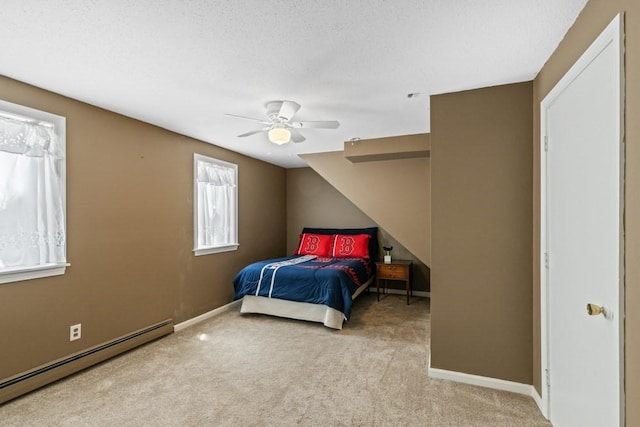 bedroom with a baseboard radiator, baseboards, a ceiling fan, and carpet flooring
