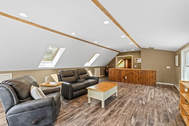living area with baseboards, wood finished floors, recessed lighting, and vaulted ceiling with skylight