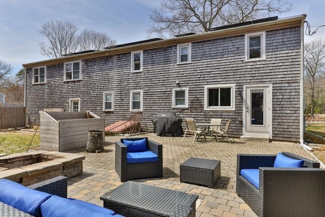 back of house featuring a patio area and an outdoor hangout area