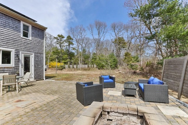 view of patio with fence and outdoor lounge area